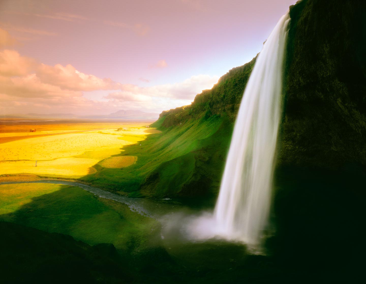 Icelandic landscape by photographer Ron Bambridge. This is the Seljalandsfoss waterfall on the south side of the island